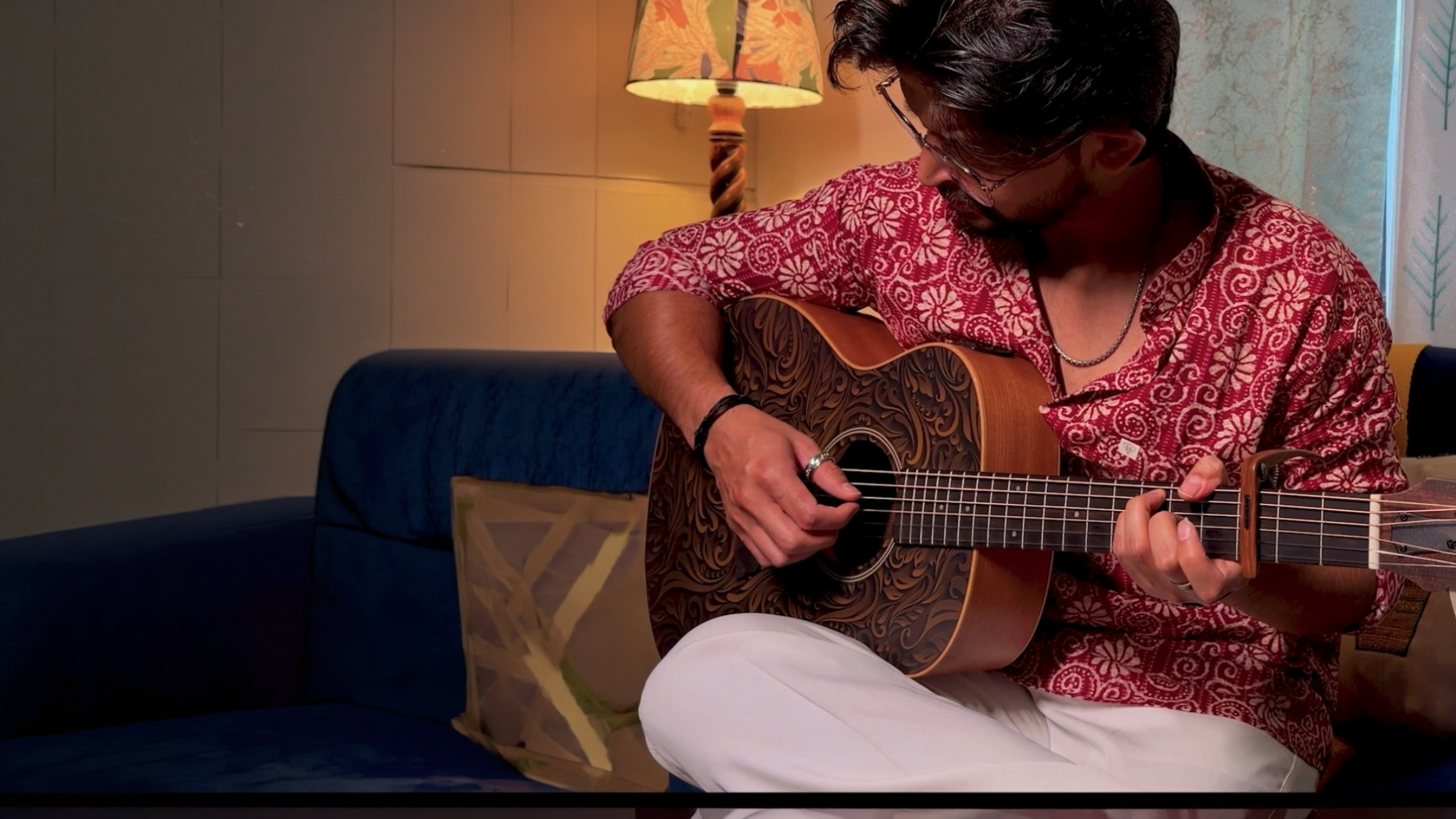 Musician playing acoustic guitar
